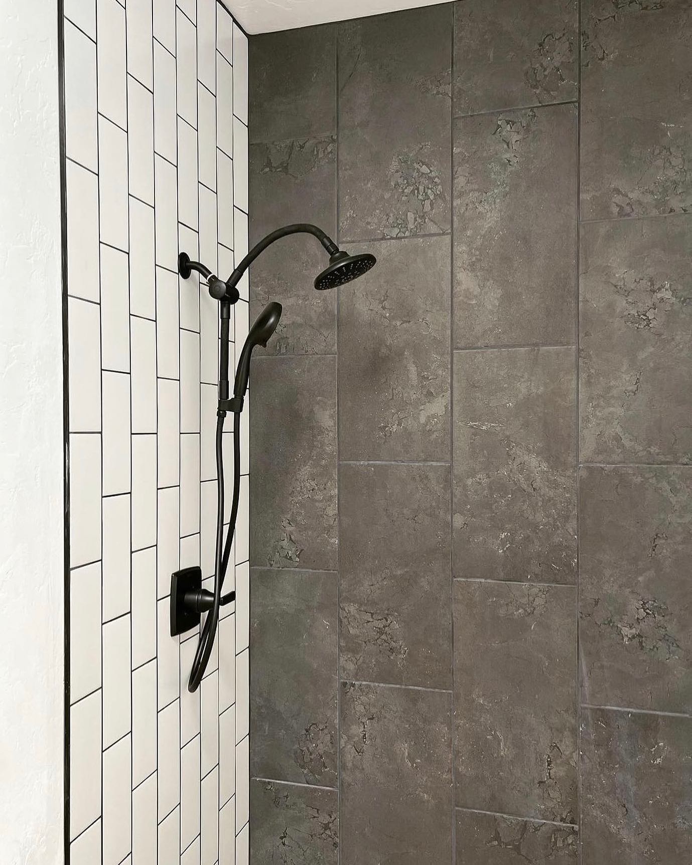 Great tile selects & install by @poplinconstructiontucson 👌🏼featuring our concrete look Newport series, in the color Pier, and Flex - one of our many classic subway series in White. #emsertile #showerdesign